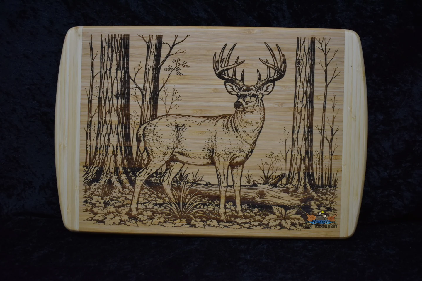 Whitetail buck in timber engraved on a cutting board